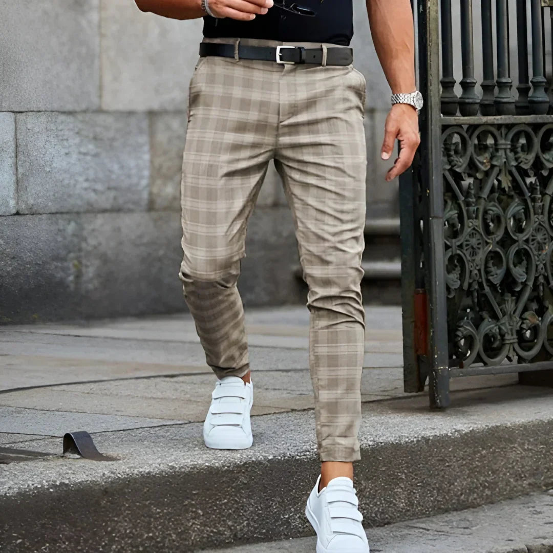 Fashionable men's slim fit cropped checked trousers, embodying sharp and versatile style.