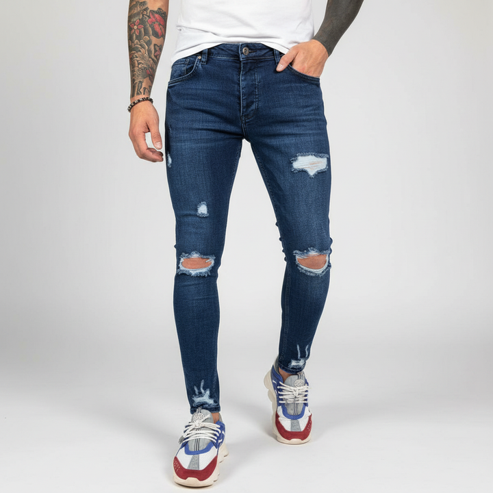 Theo Slim Fit Men's Jeans in blue denim with stylish distressed accents, ideal for a modern look.
