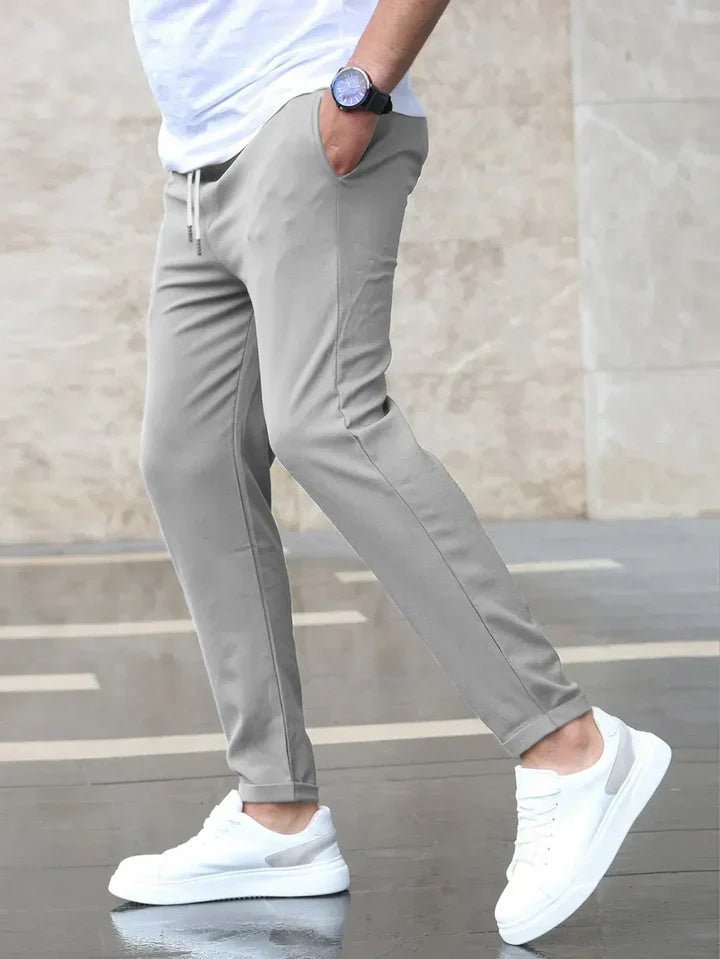 Men's comfortable stretch drawstring chino pants for versatile casual and everyday styling.