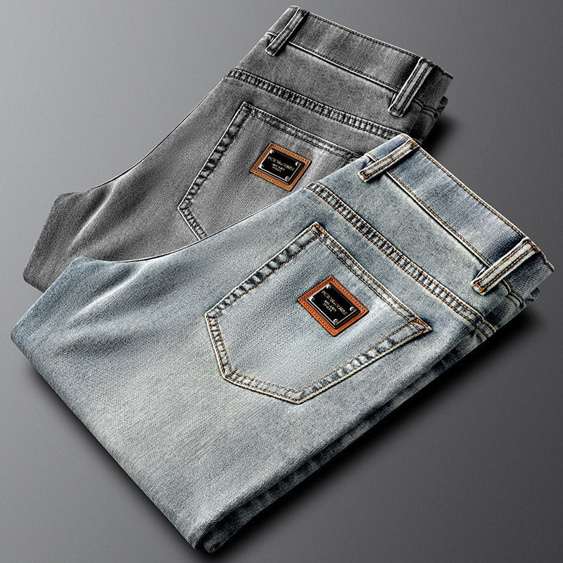 Gray slim fit stretch denim jeans for men, offering a modern and comfortable casual pant option.