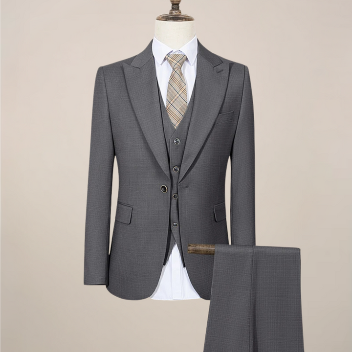 Modern men's fashion: slim fit green three-piece summer suit for a sharp, tailored look.