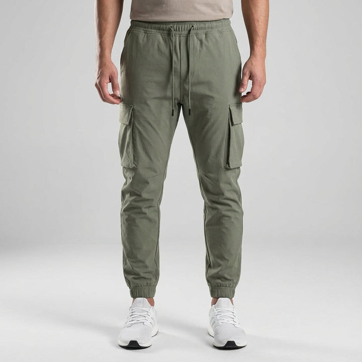 Close-up of men's slim fit jogger trousers fabric, highlighting breathable and durable material