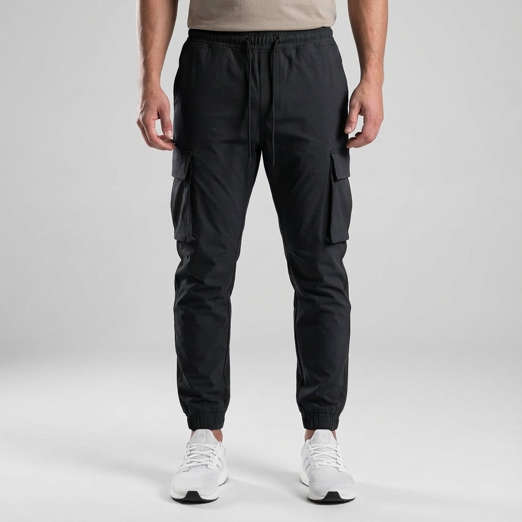 Men's slim fit joggers from the front, featuring elastic waist and functional utility pockets