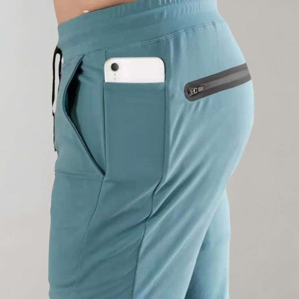 Niko men's slim fit jogging trousers. Comfortable polyester fabric for athletic, workout, & casual wear.