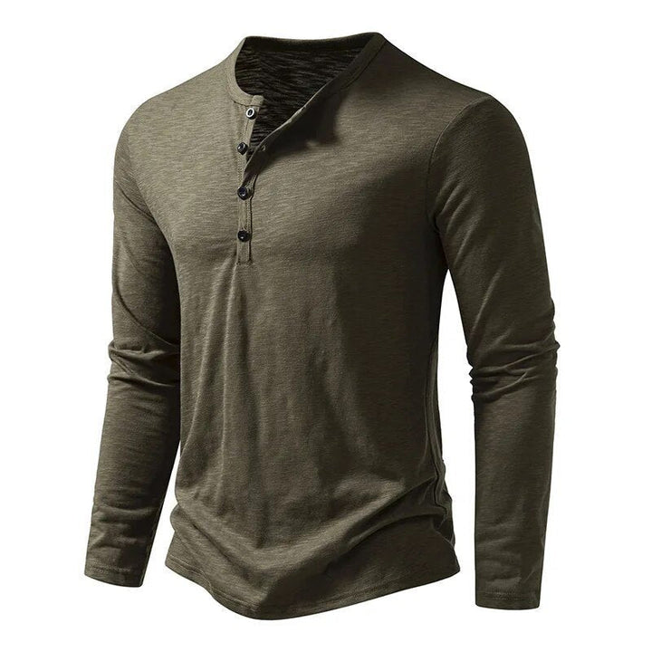 Closeup of the button placket on a men's slim fit long sleeve Henley shirt, quality detail.