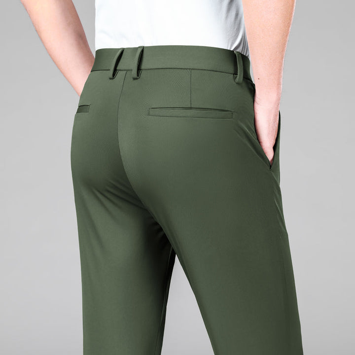 Comfortable men's slim fit trousers, featuring moisture-wicking and flexible performance.