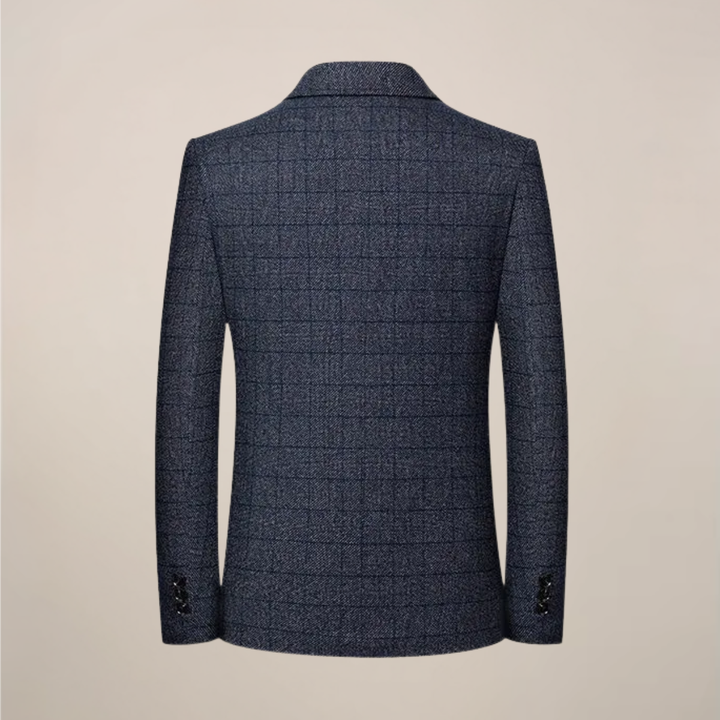 Stylish men's slim fit plaid blazer, a checkered jacket for fall fashion or spring event attire. Vintage style.