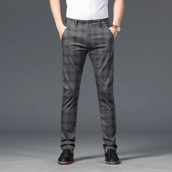 Elegant men's slim fit plaid dress pants, ideal for fashion-forward wardrobes, offering a sharp silhouette.