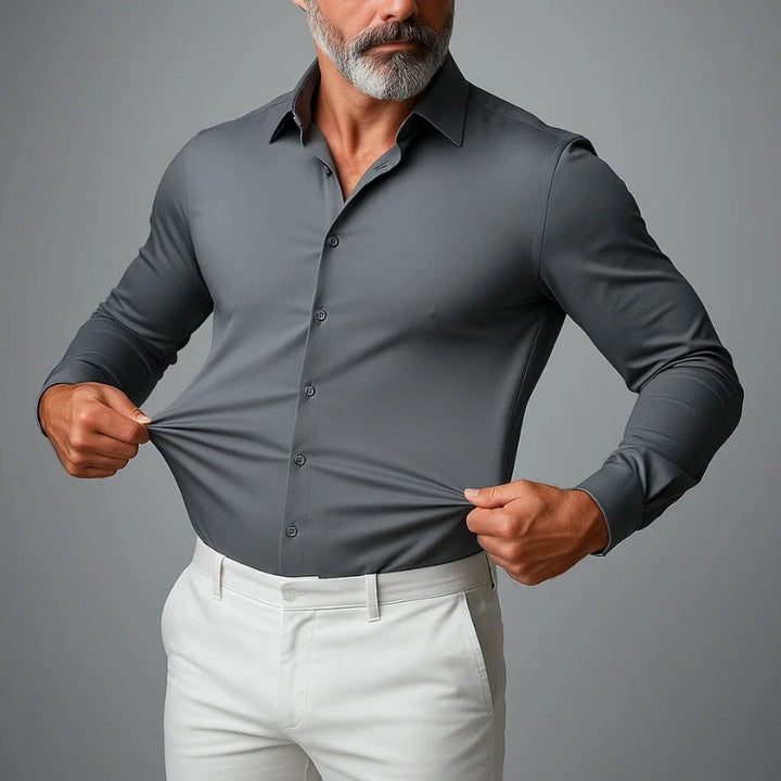 Professional man in a wrinkle-free slim fit dress shirt. Comfortable stretch for long office hours.