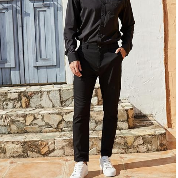 Detail of the back pocket on men's stretch dress trousers, subtle and functional