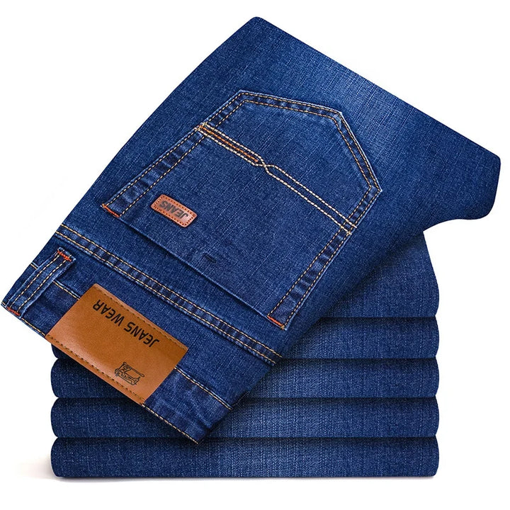 Close-up of comfortable men's slim fit stretch denim fabric, highlighting texture & quality.