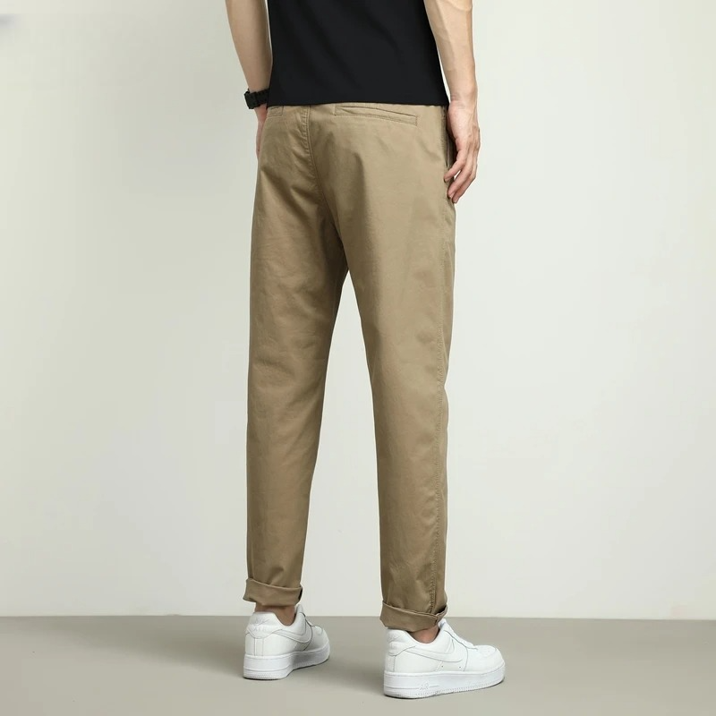 Khaki slim-fit men's stretch tech pants. Water-resistant & comfortable for active days.