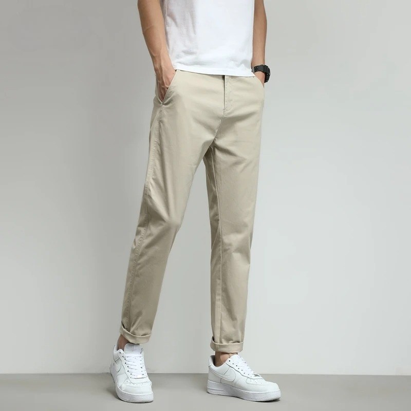 Beige slim-fit stretch tech travel trousers for men. Durable, breathable, & versatile.
