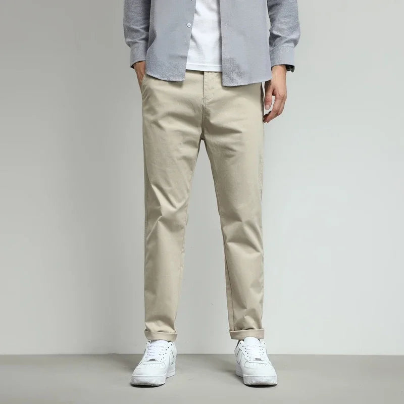Green men's slim-fit tech trousers. Stretch fabric provides comfort & mobility for modern men.