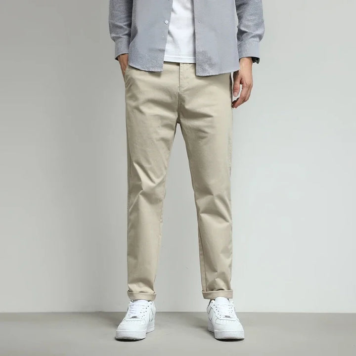 Green men's slim-fit tech trousers. Stretch fabric provides comfort & mobility for modern men.