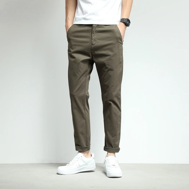 Men's black water-resistant slim-fit stretch pants. Perfect for outdoor activities & travel.