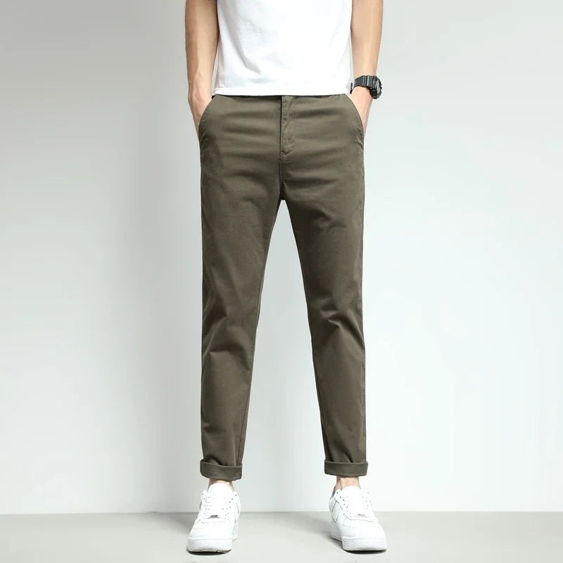 Versatile slim-fit stretch tech trousers for men. Available in multiple colors including beige & green.