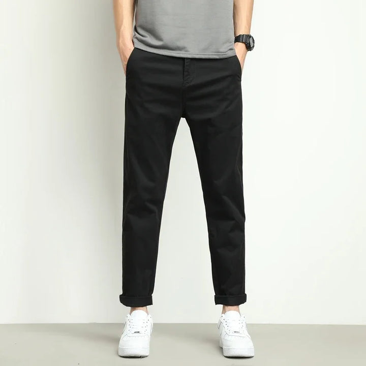 Modern slim-fit stretch tech trousers for men. Breathable fabric in khaki, ideal for casual or smart wear.