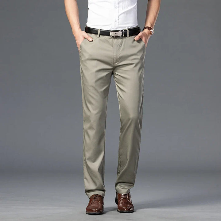 Men's slim fit dress trousers with stretch fabric, perfect for professional settings or elegant casual outfits.