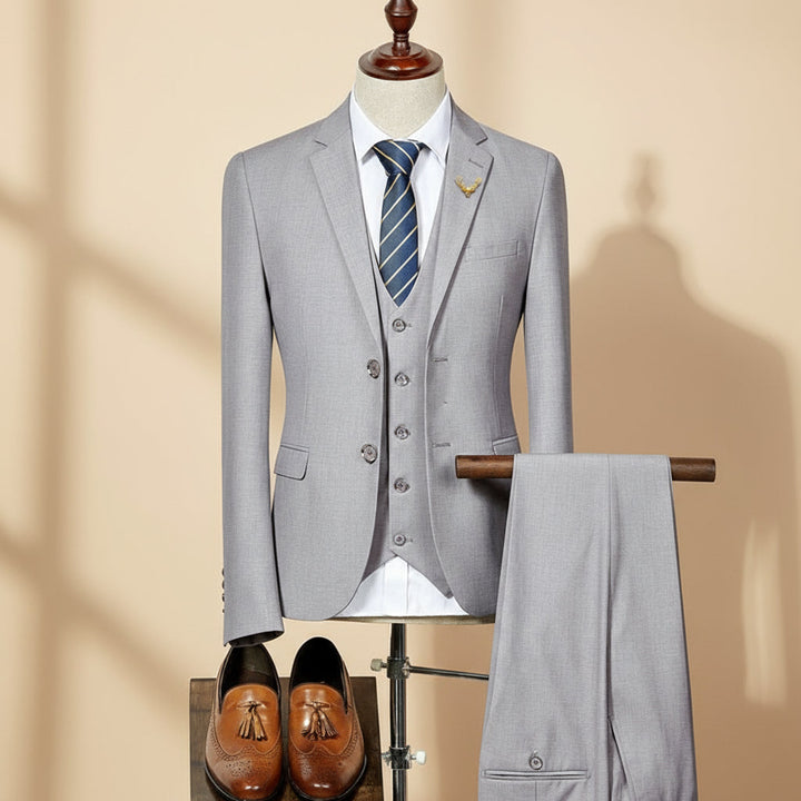 Men's slim fit three-piece suit for weddings. Tailored jacket, waistcoat & trousers in classic color.