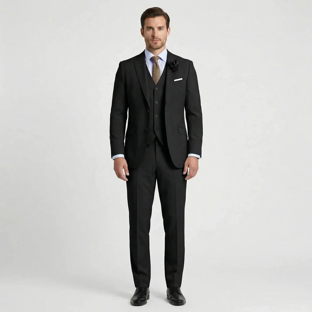 Man in a sharp slim fit three-piece suit, ready for a formal event. Modern and elegant men's fashion attire.