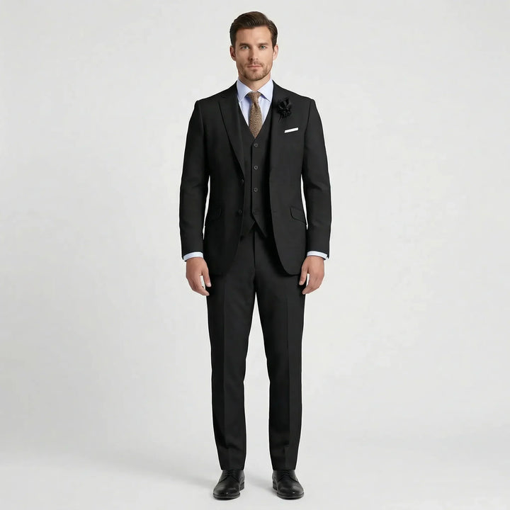 Man in a sharp slim fit three-piece suit, ready for a formal event. Modern and elegant men's fashion attire.