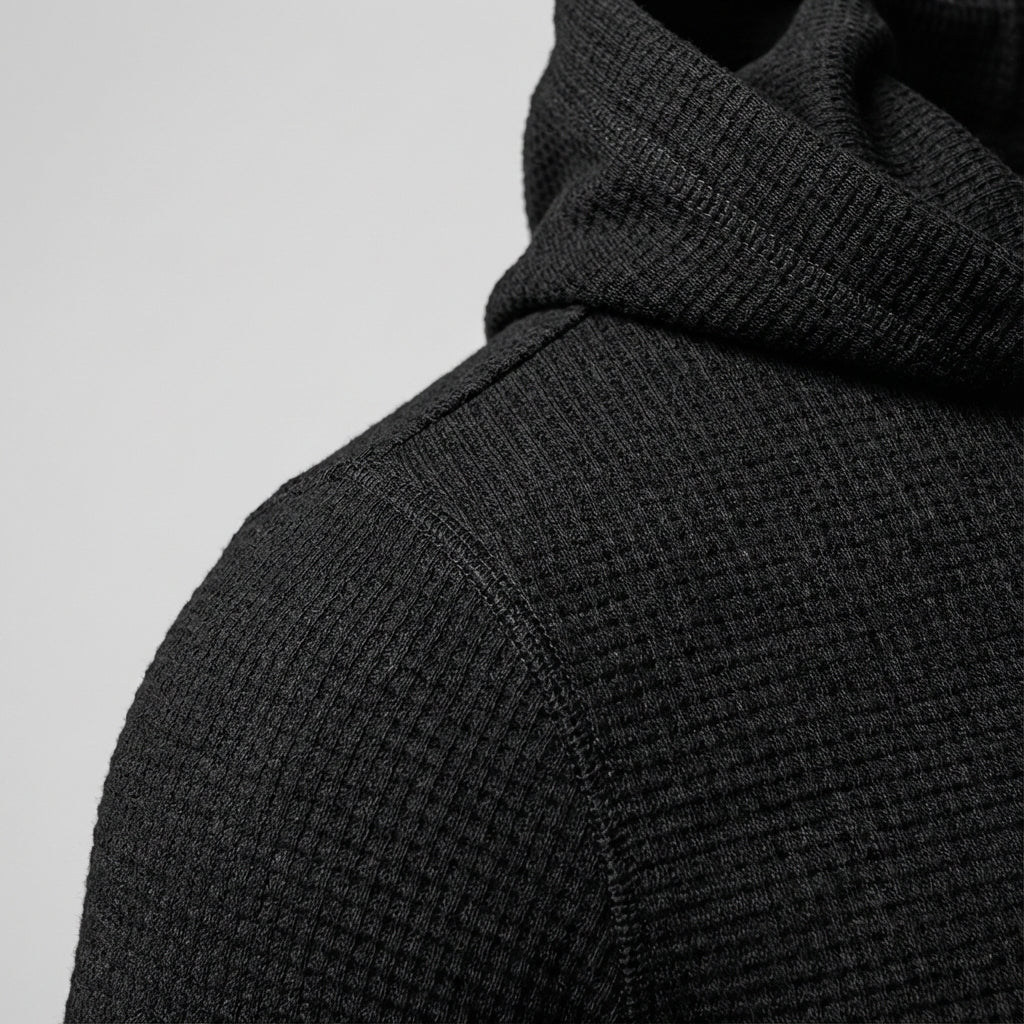 Close-up of the textured fabric on a men's training hoodie, perfect for gym attire.