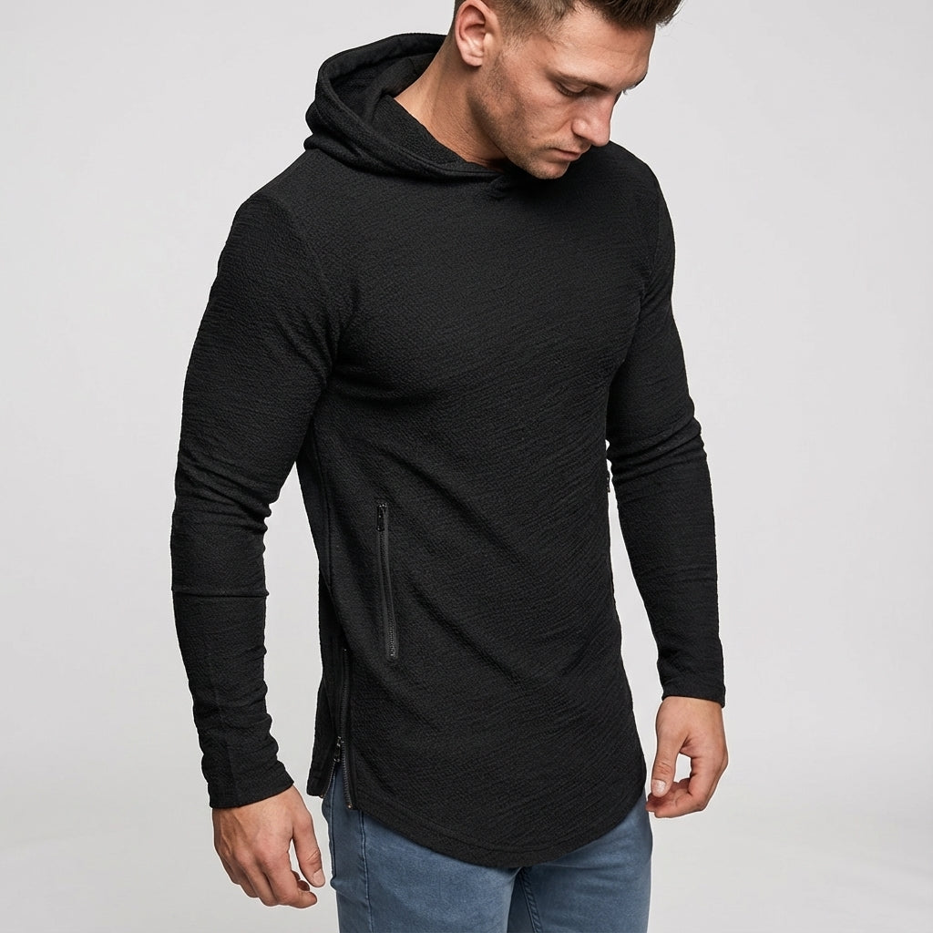Male model wearing a gray slim fit training hoodie, showcasing its activewear design.