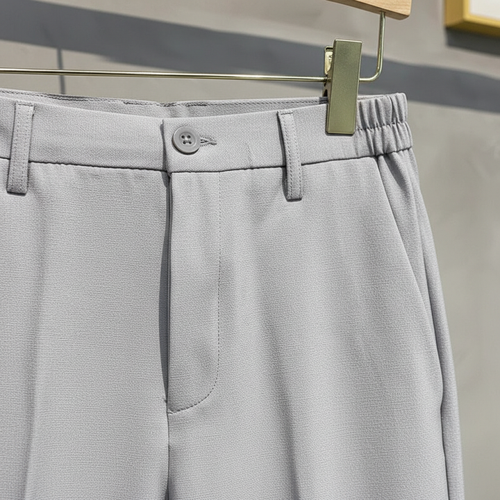 Front view of men's comfortable slim fit trousers with elastic waist, ideal for fall/winter fashion.