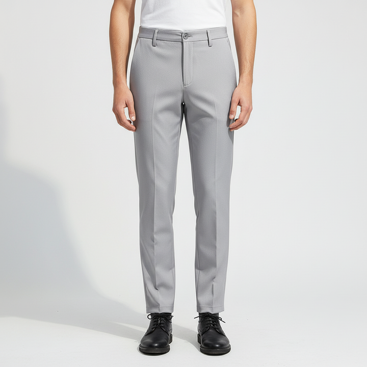 Detail of elastic waistband on men's slim fit trousers, ensuring a comfortable and snug fit.