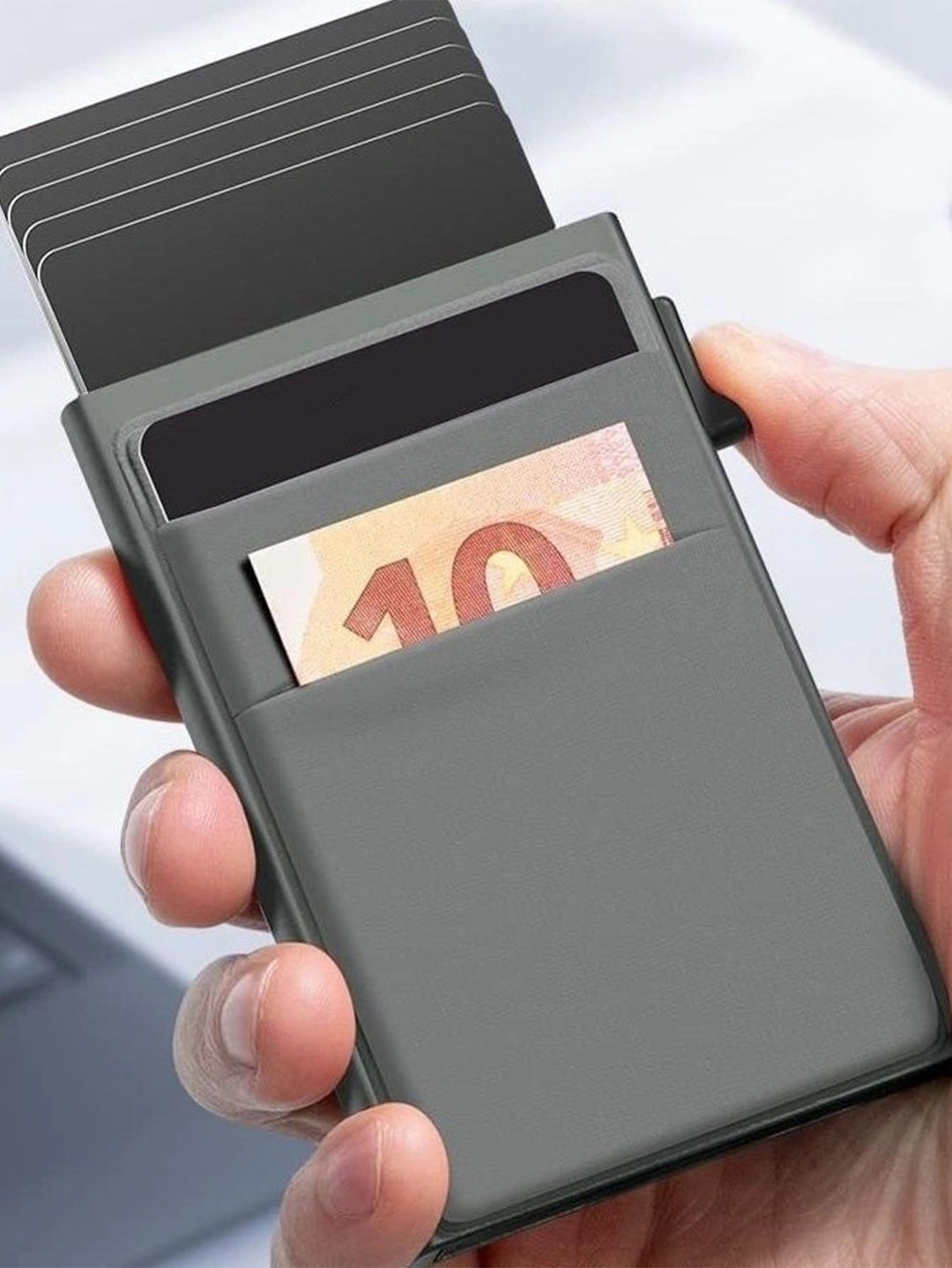Stack of credit cards held securely within a slim RFID metal wallet, emphasizing security