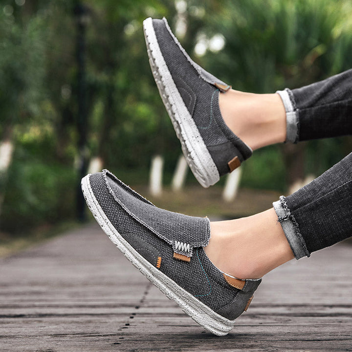 Comfortable men's flat slip-on loafers, lightweight casual shoes ideal for everyday use.