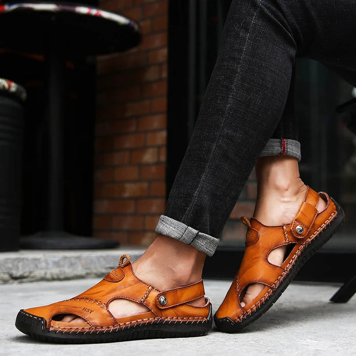 Breathable closed-toe men's slip-on sandals with cushioned arch support & non-slip sole for daily comfort.