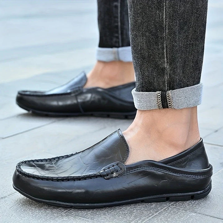 Modern classic men's slip-on loafers. Combining comfort, style, and versatility for any occasion.