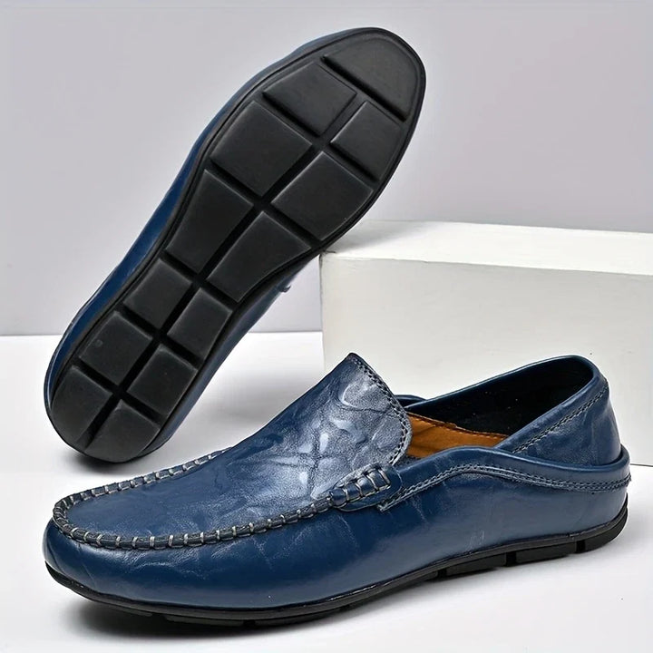 Tan men's slip-on loafers. Stylish, comfortable walking shoes; perfect for casual or dressy looks.