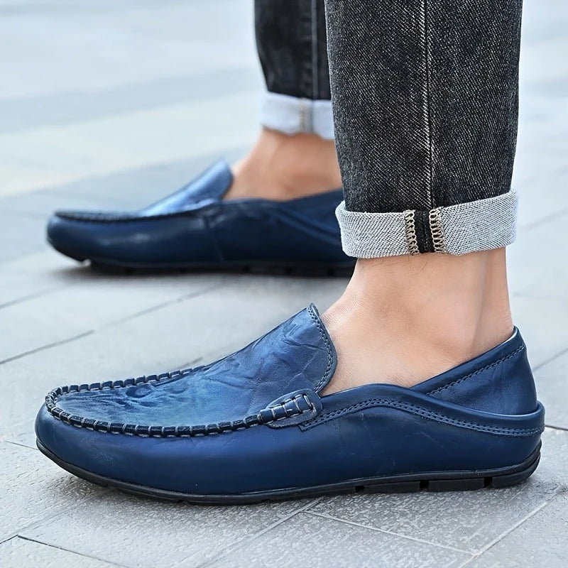 Black men's slip-on loafers. Essential formal & casual dress shoes, offering comfort & classic style.