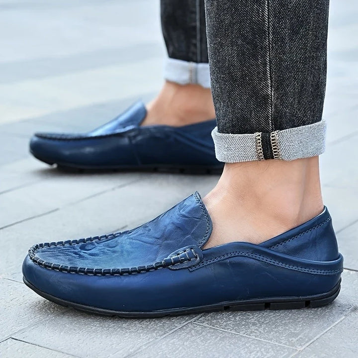 Black men's slip-on loafers. Essential formal & casual dress shoes, offering comfort & classic style.
