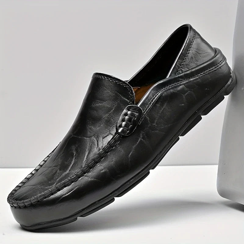 Refined men's slip-on dress loafers. Polished, comfortable footwear for a classic, stylish look.