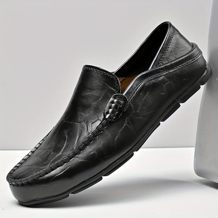 Refined men's slip-on dress loafers. Polished, comfortable footwear for a classic, stylish look.