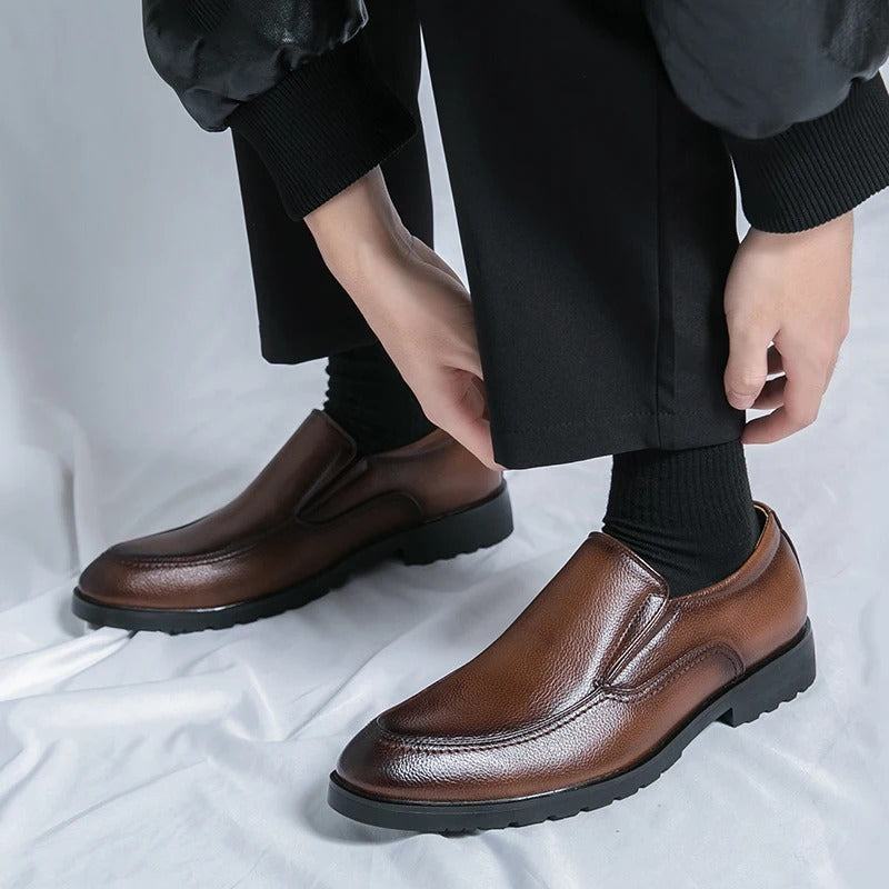 Brown men's slip-on loafers, combining casual appeal with a dressy look. Comfortable fashion.