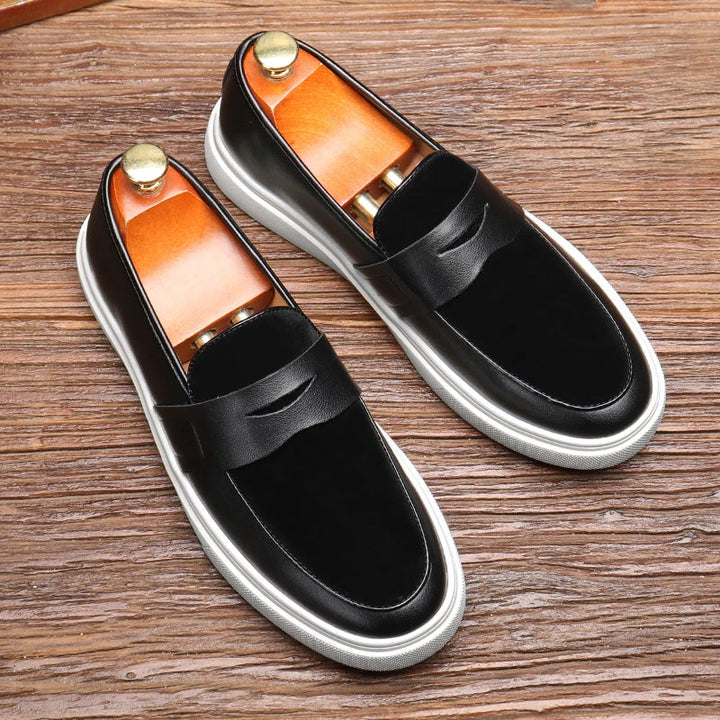 Elegant black slip-on loafers for men. Perfect for office wear, dress casual, or weekend style.