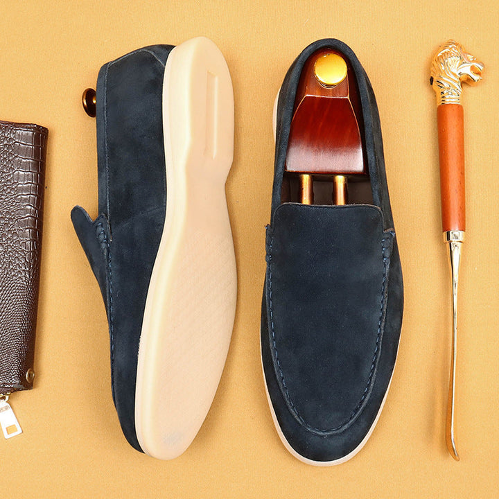 Stylish men's black leather slip-on loafers. Comfort footwear for versatile casual & dress fashion.