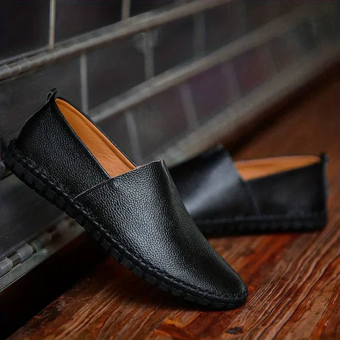 Modern men's slip-on summer loafers, blending comfort with sleek fashion for warm weather and holidays.