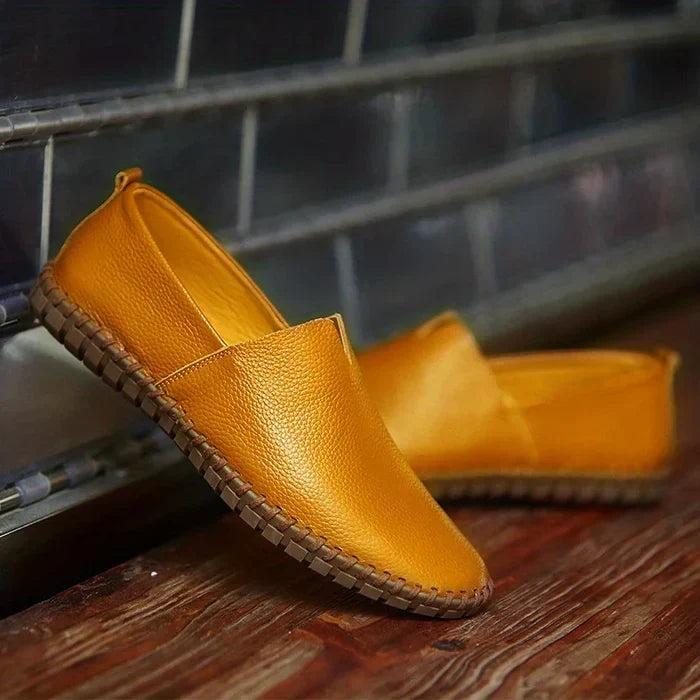 Close-up of men's blue linen slip-on loafers, showcasing breathable fabric for ultimate summer comfort.
