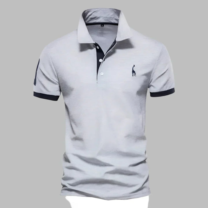 Man wearing a classic men's smart contrast trim polo shirt, suitable for versatile outfits.