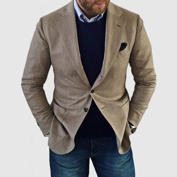 Stylish men's blue two-button blazer, ideal for events, business casual, or semi-formal wear. Tailored fit menswear.