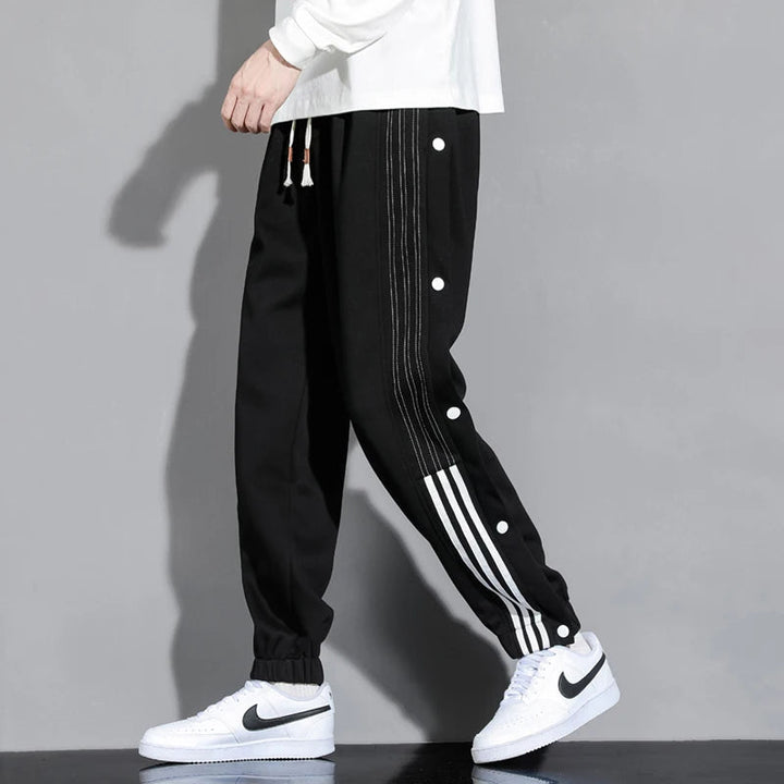 Men's Snap-Track Joggers in black, combining effortless style & comfort for athletic or casual wear.