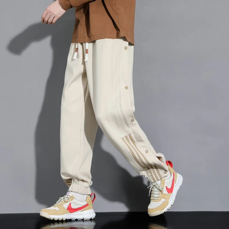 Stylish khaki men's snap-track joggers, offering ultimate comfort & modern design for all-day wear.