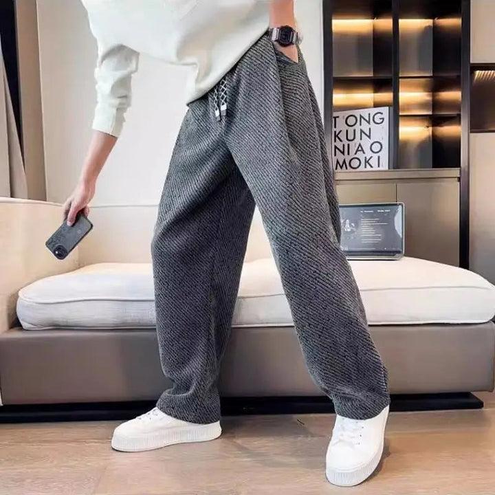 Cozy men's tapered knit lounge pants with a soft brushed interior, perfect for relaxing at home.