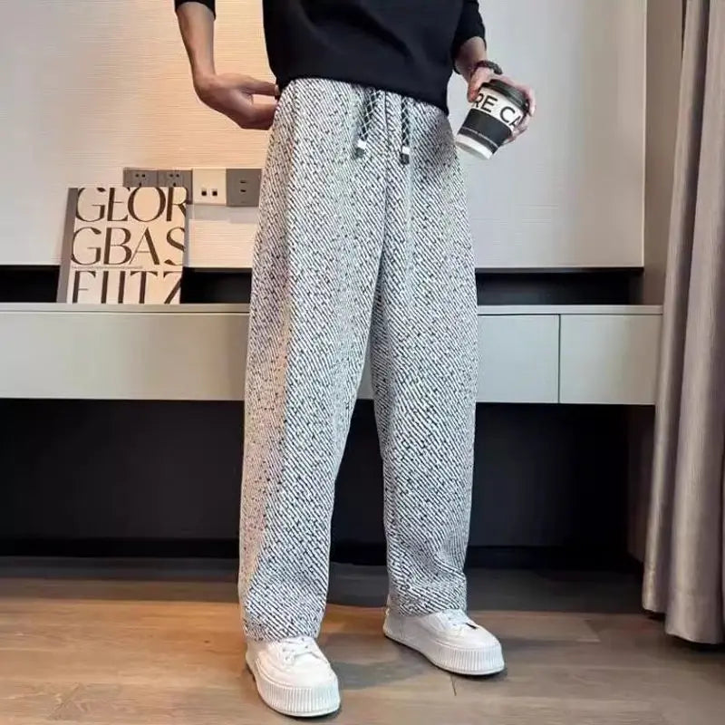 Warm men's brushed knit lounge pants with a modern tapered fit, essential for winter fashion.